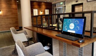 Business center with computer, printer and confortable mobiliary at the Hilton Garden Inn Birmingham Brindleyplace.