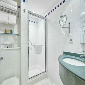 Guest bathroom with shower and toiletries at the Hilton Garden Inn Birmingham Brindleyplace.