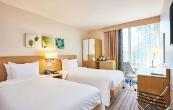 Twin room with work desk and TV at the Hilton Garden Inn Birmingham Brindleyplace.