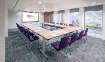 Spacious meeting room with comfortable mobiliary and large windows at the Hilton Garden Inn Birmingham Brindleyplace.