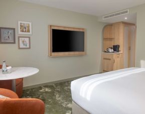 Day use guest room with lounge area and TV at the DoubleTree by Hilton Bristol North.