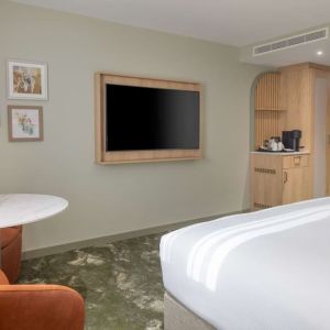 Day use guest room with lounge area and TV at the DoubleTree by Hilton Bristol North.