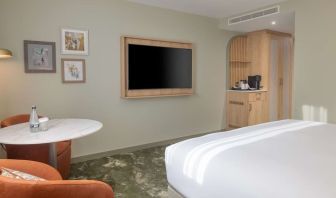 Day use guest room with lounge area and TV at the DoubleTree by Hilton Bristol North.