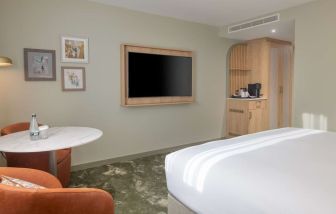 Day use guest room with lounge area and TV at the DoubleTree by Hilton Bristol North.