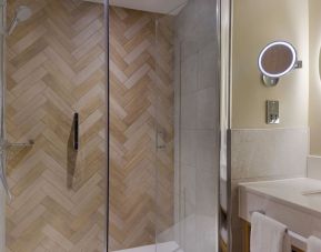 Guest bathroom with shower and toiletries at the DoubleTree by Hilton Bristol North.