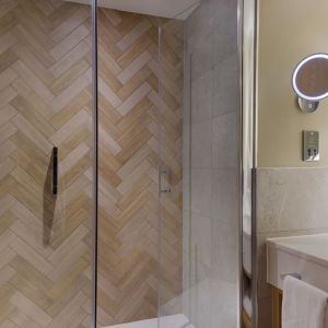 Guest bathroom with shower and toiletries at the DoubleTree by Hilton Bristol North.