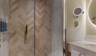 Guest bathroom with shower and toiletries at the DoubleTree by Hilton Bristol North.