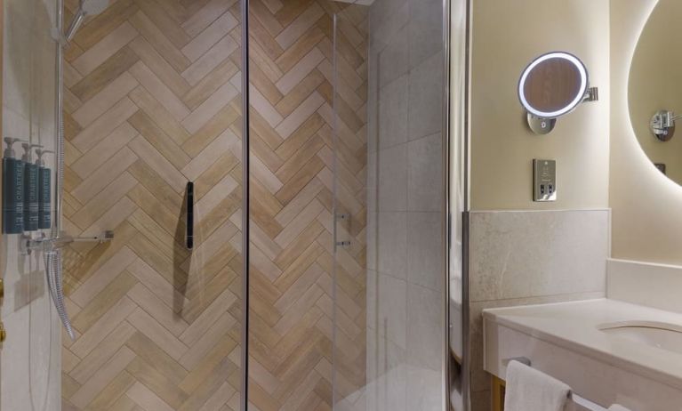 Guest bathroom with shower and toiletries at the DoubleTree by Hilton Bristol North.