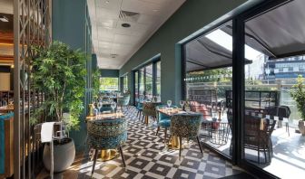 Hotel restaurant with lake view at the Hilton Birmingham Metropole.