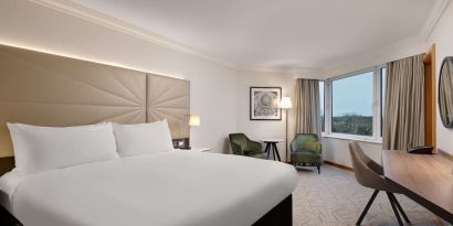 Day use guest room with view, work desk and lounge area at the Hilton Birmingham Metropole.