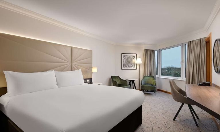 Day use guest room with view, work desk and lounge area at the Hilton Birmingham Metropole.