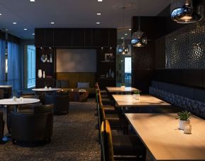 Dining area perfect for coworking at AC Hotel Cincinnati At Liberty Center.