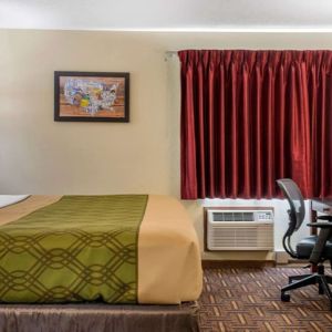 King room with work desk at Coratel Inn & Suites By Jasper River Falls.