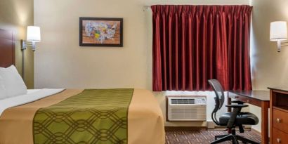 King room with work desk at Coratel Inn & Suites By Jasper River Falls.