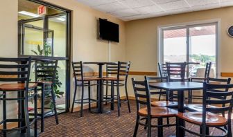 Dining room at Coratel Inn & Suites By Jasper River Falls.