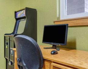 Work desk and ATM at Coratel Inn & Suites By Jasper River Falls.