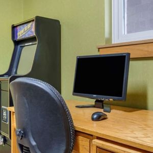 Work desk and ATM at Coratel Inn & Suites By Jasper River Falls.