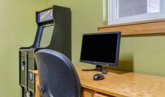 Work desk and ATM at Coratel Inn & Suites By Jasper River Falls.