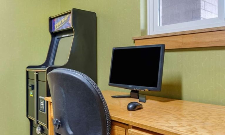 Work desk and ATM at Coratel Inn & Suites By Jasper River Falls.