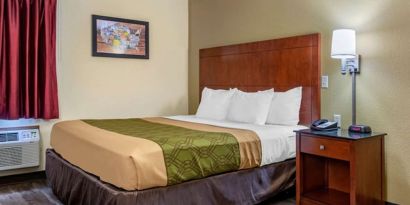 King room at Coratel Inn & Suites By Jasper River Falls.