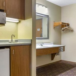 Guest bathroom and kitchen area at Coratel Inn & Suites By Jasper River Falls.