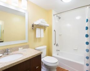 Guest bathroom with shower and tub at TownePlace Suites By Marriott Shreveport-Bossier City.