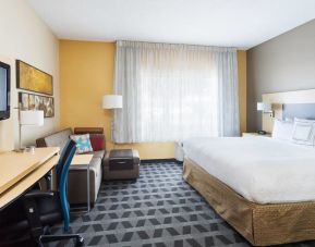 Day use room with work desk and sofa at TownePlace Suites By Marriott Shreveport-Bossier City.