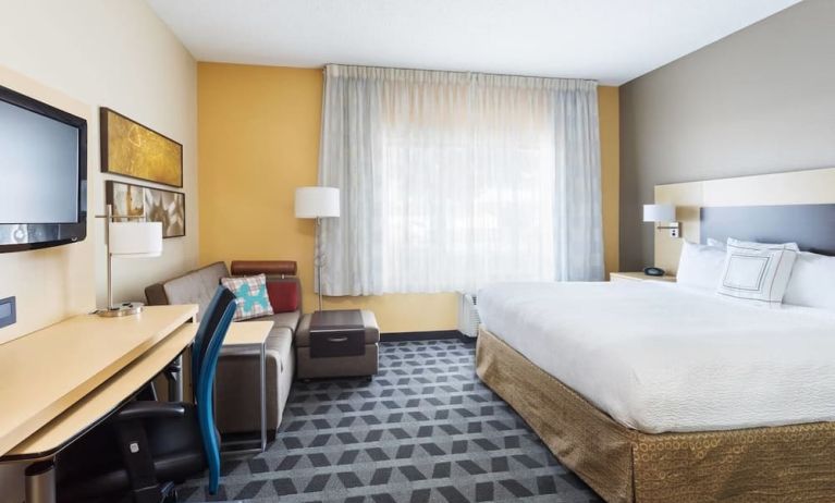 Day use room with work desk and sofa at TownePlace Suites By Marriott Shreveport-Bossier City.