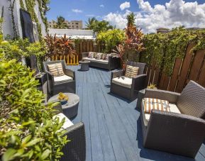 Comfortable outdoor meeting space at Hollywood Beach Suites, A South Beach Group Hotel.