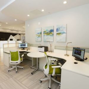 Business center with computers, ergonomic chairs and printer at Executive Residency By Best Western.