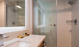 Day use guest bathroom with shower and toiletries at Executive Residency By Best Western.