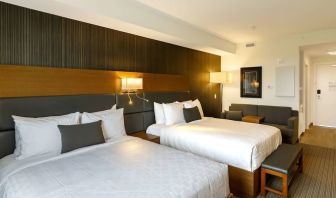 Twin bed day use room with sofa, work desk and private bathroom at Executive Residency By Best Western.