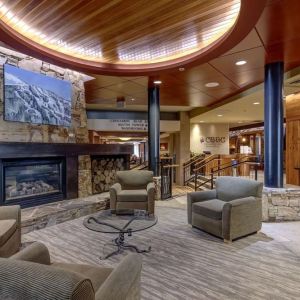 Hotel lobby with lounge area and fire place at Hilton Whistler Resort & Spa.