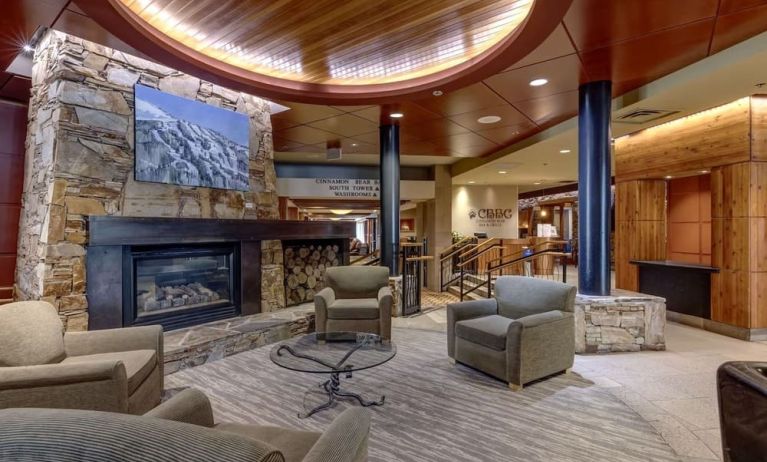 Hotel lobby with lounge area and fire place at Hilton Whistler Resort & Spa.