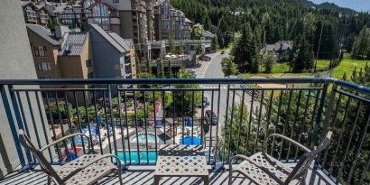 Room terrace with panoramic view at Hilton Whistler Resort & Spa.