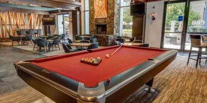 Game room and lounge area at Hilton Whistler Resort & Spa.