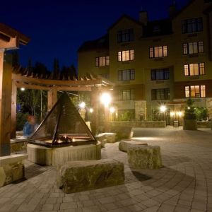 Hotel outdoor with fire place at Hilton Whistler Resort & Spa.