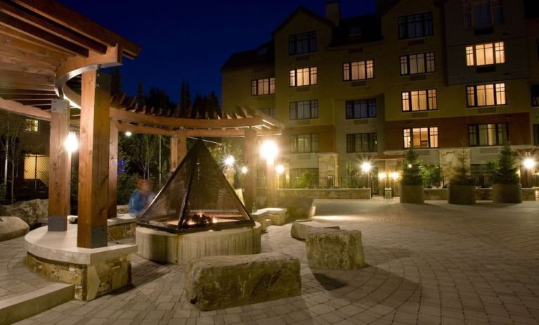 Hotel outdoor with fire place at Hilton Whistler Resort & Spa.