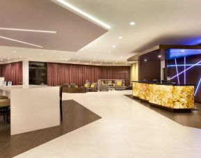 Hotel lobby with lounge area and work space  at the Double Tree Toronto Airport West.