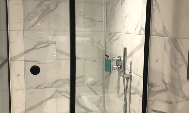 Guest bathroom with shower at Euston Square Hotel.