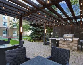 Hotel patio and outdoor lounge area at Homewood Suites By Hilton Burlington.