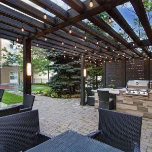 Hotel patio and outdoor lounge area at Homewood Suites By Hilton Burlington.