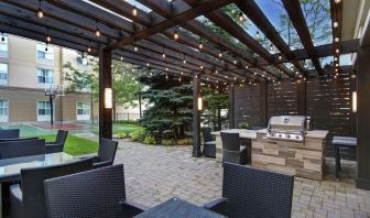 Hotel patio and outdoor lounge area at Homewood Suites By Hilton Burlington.