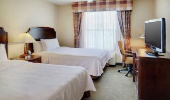 Day use twin room with TV and work desk at Homewood Suites By Hilton Burlington.