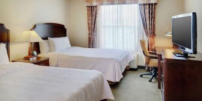 Day use twin room with TV and work desk at Homewood Suites By Hilton Burlington.