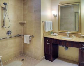 Guest bathroom with shower and toiletries at Homewood Suites By Hilton Burlington.