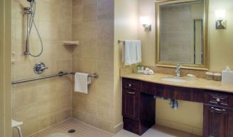 Guest bathroom with shower and toiletries at Homewood Suites By Hilton Burlington.