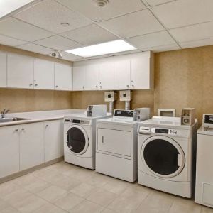 Laundry room at Homewood Suites By Hilton Burlington.