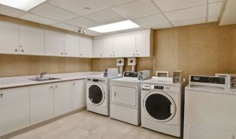 Laundry room at Homewood Suites By Hilton Burlington.