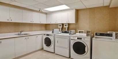 Laundry room at Homewood Suites By Hilton Burlington.